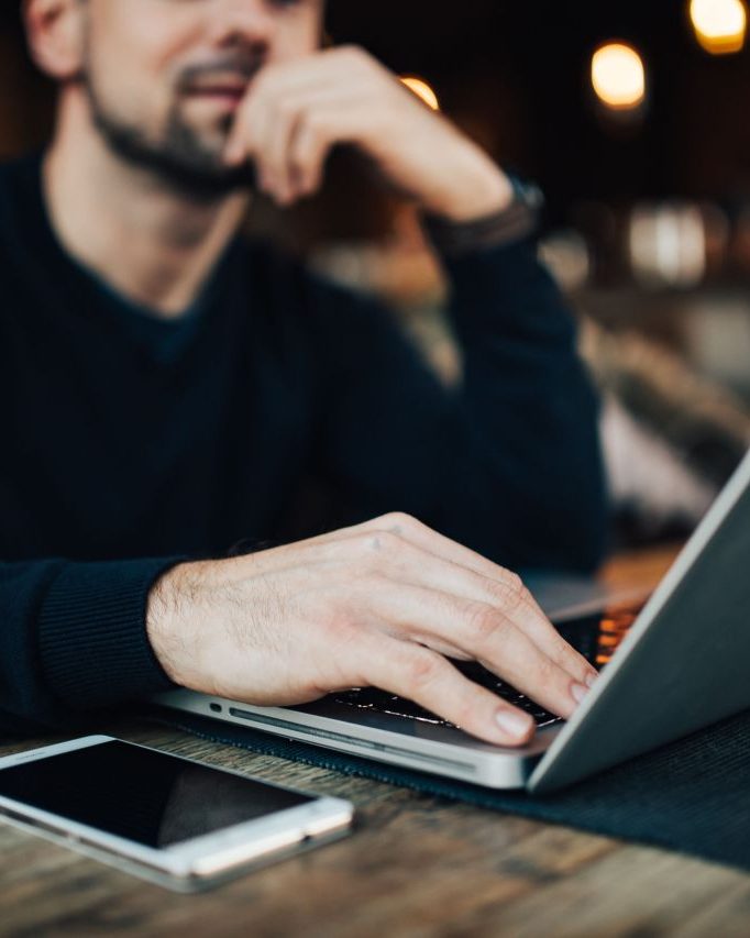 Entrepreneur building his platform on a laptop